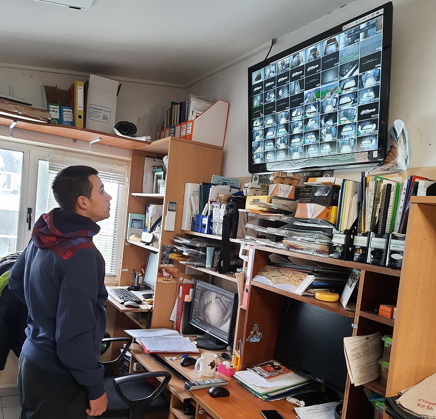 a young man looking at the screen